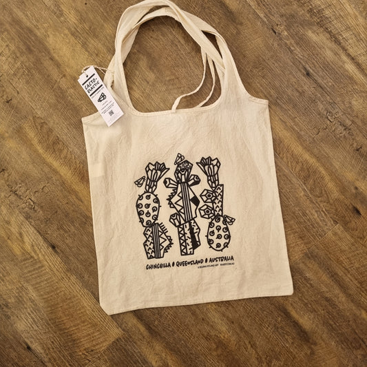 A natural calico tote bag with a black stylized cacto-blastis print. Inspired by Chinchilla, Queensland, Australia. The bag has two long handles and an eco-friendly design.